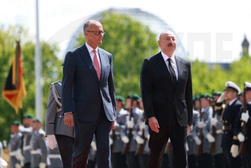 epa13124393 German Chancellor Friedrich Merz (L) welcomes Azerbaijani President Ilham Aliyev with military honors at the Chancellery in Berlin, Germany, 21 July 2026. Merz and Aliyev met for bilateral talks.  EPA/CLEMENS BILAN