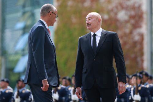 epa13124405 German Chancellor Friedrich Merz (L) welcomes Azerbaijani President Ilham Aliyev with military honors at the Chancellery in Berlin, Germany, 21 July 2026. Merz and Aliyev met for bilateral talks.  EPA/CLEMENS BILAN