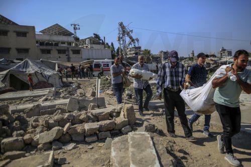 epa13124415 Palestinian relatives of the Al-Masri family conduct their burial ceremony at a cemetery, in Gaza City, Gaza Strip, 21 July 2026. Firas Al-Masri, his wife, Salsabil, and their four children were killed in Gaza City, when the Israeli army targeted their home with a drone early 21 July, according to the Gaza Ministry of Health.  EPA/MOHAMMED SABER