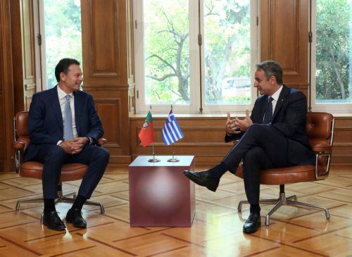 epa13126121 Greek Prime Minister Kyriakos Mitsotakis (R) speaks with Portuguese Prime Minister Luis Montenegro (L) during their meeting at the Maximos Mansion in Athens, Greece, 22 July 2026. Montenegro is in Athens for a bilateral working meeting with his Greek counterpart.  EPA/ORESTIS PANAGIOTOU