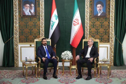 epa13127831 A handout picture made available by the Iranian presidential office shows Iranian President Masoud Pezeshkian (R) and Iraqi Prime Minister Ali al-Zaidi (L) attending a meeting in Tehran, Iran, 23 July 2026. The Iraqi prime minister is on an official diplomatic trip to Tehran to hold talks with senior Iranian officials.  EPA/IRANIAN PRESIDENTIAL...