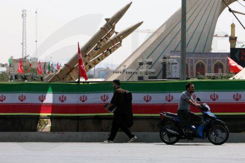 epa13129784 Iranians pass next to Iranian missiles, Zolfaghar, on display at Azadi Square in Tehran, Iran, 24 July 2026. Conflict between Iran and the US over the Strait of Hormuz continues, as US strikes have targeted several locations across Iran.  EPA/ABEDIN TAHERKENAREH RESTRICTIONS: NO Access Israel Media/Persian Language TV Stations Outside...