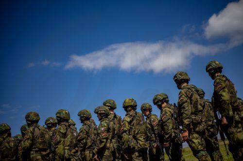 epa13130747 High school students train in basic military skills under the guidance of instructors during the final field exercise of a month-long voluntary military training course organized by the Czech Army at the Hradiste Military Area, near Bochov, Czech Republic, 24 July 2026. The Hradiste Military Area is one of ten sites across the Czech Republic...
