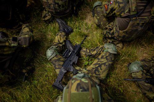 epa13130737 A participant holds an assault rifle CZ BREN 2 as high school students take a rest as they train in basic military skills during the final field exercise of a month-long voluntary military training course organized by the Czech Army at the Hradiste Military Area, near Bochov, Czech Republic, 24 July 2026. The Hradiste Military Area is one of ten...