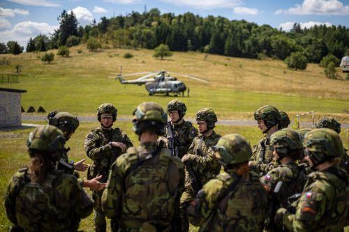epa13130741 High school students train in basic military skills under the guidance of instructors during the final field exercise of a month-long voluntary military training course organized by the Czech Army at the Hradiste Military Area, near Bochov, Czech Republic, 24 July 2026. The Hradiste Military Area is one of ten sites across the Czech Republic...