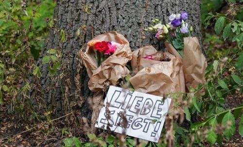 epa13133581 A sign reading "Love Wins!" lies among flowers near the scene where a vehicle plowed into a crowd on the sideline of the Christopher Street Day (CSD) parade in Berlin, Germany, 26 July 2026. One person died and 16 others were injured on the sidelines of the Christopher Street Day event in Berlin after a vehicle plowed into a crowd on 25 July...