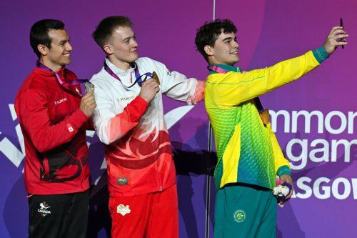 epa13135702 (L-R) Silver medallist Rene Cournoyer of Canada, Gold medallist Luke Whitehouse of England and Bronze medallist James Hardy of Australia pose on the podium after the Artistic Gymnastics Men’s Floor Exercise Final during the Glasgow 2026 Commonwealth Games at the Glasgow International Arena in Glasgow, Britain, 27 July 2026.  EPA/LUKAS COCH...
