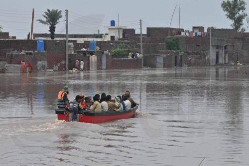 epa13135843 People travel aboard a rescue boat through a flooded area after heavy monsoon rains caused the Ravi River to rise in Muridke, Pakistan, 27 July 2026. Authorities established 17 flood relief camps across Lahore Division, mainly in Nankana Sahib and Sheikhupura, and introduced an AI-based dashboard to monitor reservoir conditions and support flood...