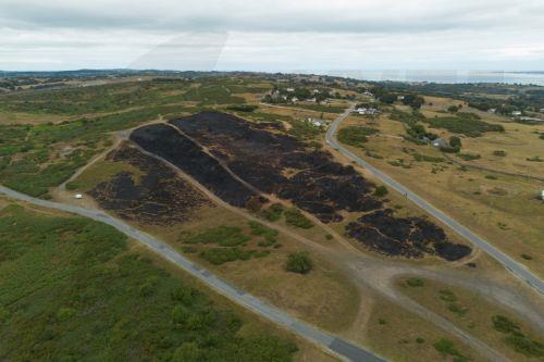 epa13135882 An aerial photograph taken with a drone of wildfire damage in Halkyn, Britain, 27 July 2026. A drought was declared by Natural Resources Wales in North Wales and the Upper Severn on 23 July after a prolonged period of hot, dry weather.  EPA/ADAM VAUGHAN