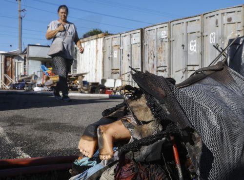 epa13141162 A burned bag with a doll is seen at the site of a Russian missile strike on a market in Kyiv, Ukraine, 30 July 2026, amid the Russian invasion. At least eight people died, and dozens of people were injured after an overnight massive combined Russian attack in Ukraine, according to the State Emergency Service. Russia launched at least 70 missiles...
