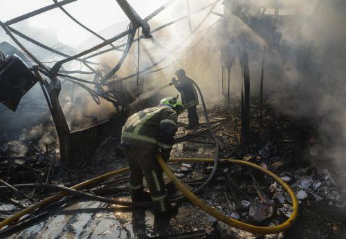 epa13141164 Ukrainian rescuers work at the site of a Russian missile strike on a market in Kyiv, Ukraine, 30 July 2026, amid the Russian invasion. At least eight people died, and dozens of people were injured after an overnight massive combined Russian attack in Ukraine, according to the State Emergency Service. Russia launched at least 70 missiles of...