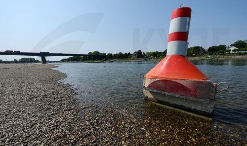 epa13141324 A buoy used to mark the waterway on the Rhine river is sitting on dry land in Speyer, Germany, 30 July 2026. Due to a severe heatwave and prolonged dry weather, water levels on the Rhine River in Germany have plunged. The German Weather Service (DWD) expects the heat wave to peak in the coming days, with temperatures between 34 and 38 degrees...