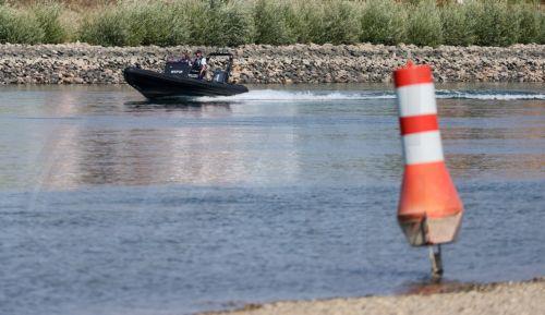 epa13141326 A buoy used to mark the waterway on the Rhine river is sitting on dry land in Speyer, Germany, 30 July 2026. Due to a severe heatwave and prolonged dry weather, water levels on the Rhine River in Germany have plunged. The German Weather Service (DWD) expects the heat wave to peak in the coming days, with temperatures between 34 and 38 degrees...