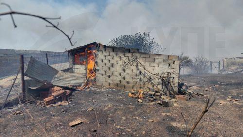 epa13144147 A wildfire burns a residence in the Fichtia area of Argolida in the Peloponnese region, Greece, 31 July 2026. Residents were ordered to evacuate toward Argos as 42 firefighters, including two teams from the 9th Special Forest Operations Unit (EMODE), 12 vehicles, four aircraft, and one helicopter battled the blaze with support from municipal...