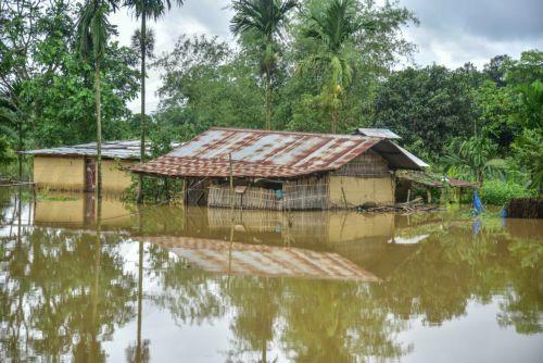 epa13151283 A partially submerged house following heavy monsoon rains in Kalapani village, Nagaon district, Assam, India, 05 August 2026. According to the Assam State Disaster Management Authority (ASDMA), the death toll from severe flooding in the north-eastern state of Assam has risen to 89, with over 200,000 residents across the state still affected by...