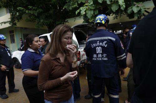 epa13155063 A relative (C) of a teacher killed in a school shooting cries after identifying the body at Debsirin Nonthaburi School in Bang Kruai district, Nonthaburi province, Thailand, 07 August 2026. Seven people were killed and 15 injured after a student opened fire inside the school campus, according to a Royal Thai Police spokesperson.  EPA/RUNGROJ...