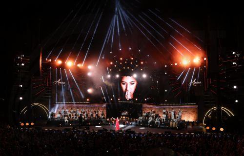 epa13176461 Tunisian singer Amina Fakhet performs during the 60th edition of the Carthage International Festival at the Roman Theatre of Carthage in Tunis, Tunisia, 17 August 2026. The festival runs from 16 July to 19 August 2026.  EPA/MOHAMED MESSARA