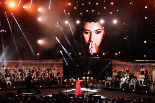 epa13176463 Tunisian singer Amina Fakhet performs during the 60th edition of the Carthage International Festival at the Roman Theatre of Carthage in Tunis, Tunisia, 17 August 2026. The festival runs from 16 July to 19 August 2026.  EPA/MOHAMED MESSARA