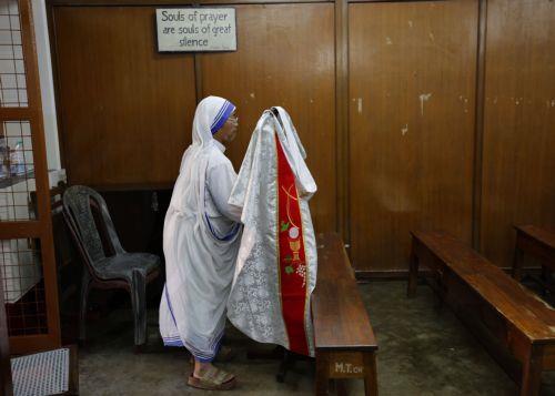 epa13191749 A nun handles a cassock before a mass prayer celebrating the 116th birth anniversary of Mother Teresa at the Mother House in Kolkata, India, 26 August 2026. Mother Teresa, born Agnes Gonxha Bojaxhiu on 26 August 1910 to Albanian parents in Skopje, began serving the poor in Calcutta in 1948 and was awarded the Nobel Peace Prize in 1979. ...