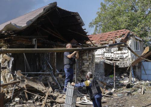 epa13194381 Ukrainian communal workers operate at the site of a Russian strike on private buildings near Kyiv, Ukraine, 27 August 2026, amid the Russian invasion. After the overnight Russian combined shelling, Ukrainian rescuers are working at 9 locations. Among them are private homes, warehouses, and fire outbreaks in ecosystems, according to the Ukrainian...