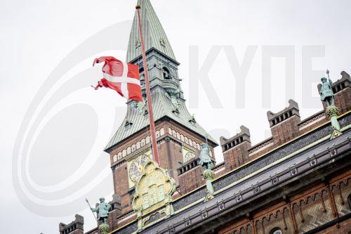 epa13196669 The Danish flag, the Dannebrog, flies at half-mast on the occasion of King Harald's death on the City Hall in Copenhagen, Denmark, 28 August 2026. Norway's King Harald V died at Oslo University Hospital at the age of 89, according to an official statement released by the Royal House of Norway on 28 August 2026. Following his death, his son Crown...