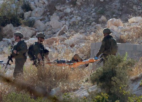epa13196972 Israeli troops carry the bodies of three Palestinians killed in an airstrike near the West Bank city of Jenin, 28 August 2026. Israel's military reported it conducted a strike against several militants in the Jenin area.  EPA/ALAA BADARNEH