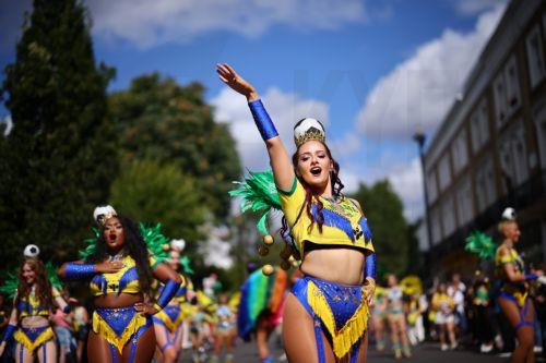 epa13202249 Costumed participants perform during the Notting Hill Carnival adults' parade in London, Britain, 31 August 2026. The carnival, marking its 60th year, is Europe's largest street carnival, celebrating Caribbean history and culture, and runs from 30 August to 31 August 2026.  EPA/TOLGA AKMEN