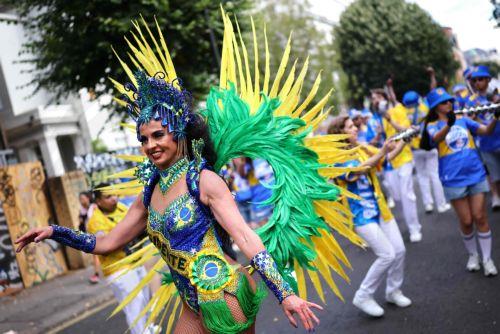 epa13202251 Costumed participants perform during the Notting Hill Carnival adults' parade in London, Britain, 31 August 2026. The carnival, marking its 60th year, is Europe's largest street carnival, celebrating Caribbean history and culture, and runs from 30 August to 31 August 2026.  EPA/TOLGA AKMEN