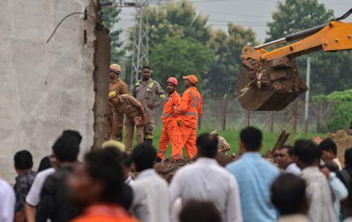 epa13202393 Members of the Indian National Disaster Response Force (NDRF) perform rescue work at a site after an explosion in a firecracker factory in Pipri, Uttar Pradesh state, India, 31 August 2026. The explosion in the  firecracker factory killed more than five people and several injured, according to official sources. The explosion also damaged the...