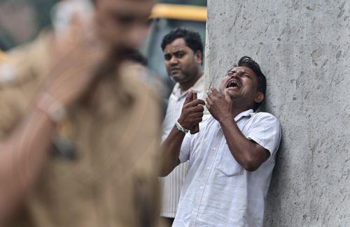 epa13202395 A relative of a victim mourns as rescue work is underway at a site after an explosion in a firecracker factory in Pipri, Uttar Pradesh state, India, 31 August 2026. The explosion in the  firecracker factory killed more than five people and several injured, according to official sources. The explosion also damaged the nearby houses.  EPA/Prabhat...