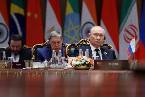 epa13233822 Russian President Vladimir Putin attends a session of the 18th BRICS Summit, with Presidential Aide Yury Ushakov behind, in New Delhi, India, 12 September 2026. India hosts the 18th BRICS Leaders' Summit from 12 to 13 September 2026 under the theme 'Building for Resilience, Innovation, Cooperation and Sustainability.'  EPA/ALEXANDER...