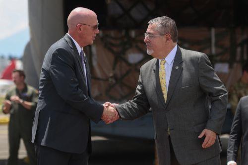 epa13254719 Guatemalan President Bernardo Arevalo de Leon (R) greets the US Embassy's Chief of Mission, Jorgan K. Andrews (L), during the reception of a shipment of weapons purchased from the United States in Guatemala City, Guatemala, 21 September 2026. The shipment is the first such delivery since a US arms embargo imposed in 1978 was lifted in March...