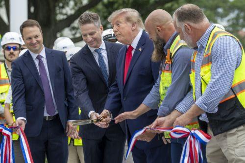 epaselect epa13254839 US President Donald Trump cuts the ribbon during the ribbon-cutting ceremony for the new helipad on the South Lawn of the White House in Washington, DC, USA, 21 September 2026 (issued 22 September 2026). President Donald Trump is scheduled to depart from the newly completed White House helipad for New York, where he will attend the...