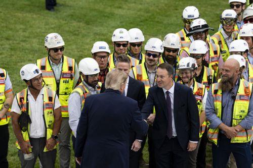 epa13254964 US President Donald Trump greets Jim Taiclet (C), chairman and chief executive officer of Lockheed Martin Corp., and Jared Oldroyd (R), division president of Clark Construction, during a ribbon-cutting ceremony for a new helipad on the South Lawn of the White House in Washington, DC, USA, 21 September 2026 (issued 22 September 2026). The new...