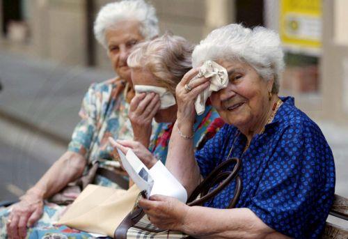 epa13273969 (FILE) - Three elderly ladies in Pontedera, Pisa, Italy, wiping the sweat from their foreheads 28 September 2007 (reissued on 01 October 2026). 01 October marks the United Nations International Day of Older Persons. This year, the theme is ‘The Age of Longevity: Rethinking Systems for Longer Lives.’  EPA/FRANCO SILVI