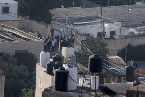 epa13274107 Israeli settlers gather near Joseph's Tomb in the eastern part of Nablus, West Bank, early 01 October 2026. According to the Palestinian news agency Wafa, Israeli military vehicles entered the eastern part of the city, forced residents to evacuate homes surrounding the site and used the houses as military posts.  EPA/ALAA BADARNEH