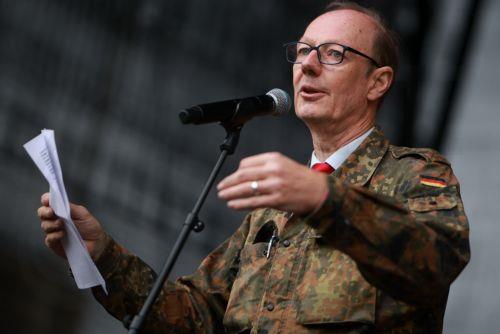 epa13277393 Member of European Parliament Martin Sonneborn speaks during a protest against compulsory military service at the Brandenburg Gate in Berlin, Germany, 02 October 2026.  EPA/CLEMENS BILAN