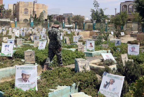 epa13277429 A Houthi soldier walks amongst portraits on the graves of slain Houthi fighters at a cemetery dedicated to those who were killed in Yemen's prolonged conflict, in Sana'a, Yemen, 02 October 2026. Yemen has been at risk of rupture again amid escalating fighting along the country’s Red Sea coastal areas near the Bab al-Mandeb Strait between...