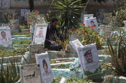epa13277433 A person sits next to the grave of a relative at a cemetery dedicated to those who were killed in Yemen's prolonged conflict, in Sana'a, Yemen, 02 October 2026. Yemen has been at risk of rupture again amid escalating fighting along the country’s Red Sea coastal areas near the Bab al-Mandeb Strait between Saudi-backed government forces and the...