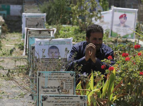 epa13277440 A person sits next to the grave of a relative at a cemetery dedicated to those who were killed in Yemen's prolonged conflict, in Sana'a, Yemen, 02 October 2026. Yemen has been at risk of rupture again amid escalating fighting along the country’s Red Sea coastal areas near the Bab al-Mandeb Strait between Saudi-backed government forces and the...