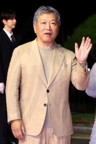 epa13286105 Japanese director Hirokazu Koreeda waves as he walks to enter the opening ceremony of the 31st Busan International Film Festival (BIFF) at the outdoor theater of the Busan Cinema Center in Busan, South Korea, 06 October 2026 (issued 07 October 2026). The festival began its 10-day run after the International Federation of Film Producers...