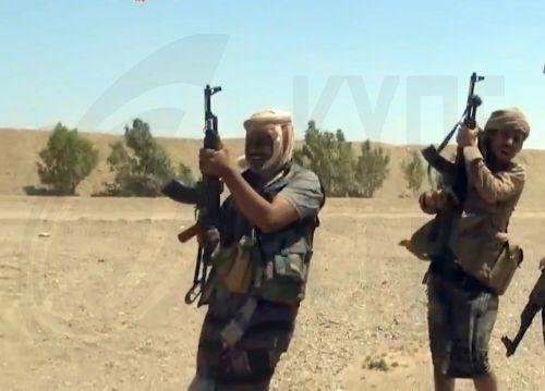 epa13286166 A handout photo made available by the Southern Giants Brigades media office shows pro-government fighters holding positions during an offensive against Houthi positions in a coastal area of Taiz province, near the Bab al-Mandeb Strait, Yemen, 06 October 2026. The Saudi-backed Yemeni government launched an offensive to retake areas under Houthi...