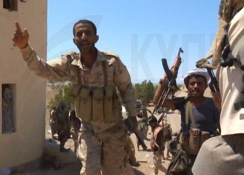 epa13286171 A handout photo made available by the Southern Giants Brigades media office shows pro-government fighters holding positions during an offensive against Houthi positions in a coastal area of Taiz province, near the Bab al-Mandeb Strait, Yemen, 06 October 2026. The Saudi-backed Yemeni government launched an offensive to retake areas under Houthi...