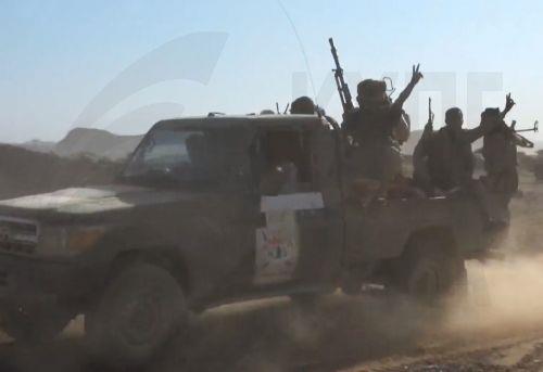 epa13286172 A handout photo made available by the Southern Giants Brigades media office shows pro-government fighters riding a truck during an offensive against Houthi positions in a coastal area of Taiz province, near the Bab al-Mandeb Strait, Yemen, 06 October 2026. The Saudi-backed Yemeni government launched an offensive to retake areas under Houthi...