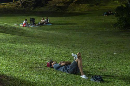 epa13293163 A man rests in a park after a magnitude 7.7 earthquake struck southeastern Panama, in Panama City, Panama, 9 October 2026. The Geosciences Institute (IGC) reported that more than a hundred aftershocks have followed the magnitude 7.5 to 7.7 earthquake that struck the southeast of the country, while civil protection sources report at least two...