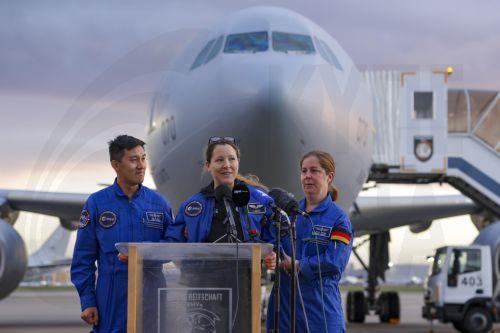 epa13293353 European Space Agency (ESA) astronaut Sophie Adenot (C) of France talks to the media upon arrival at the military section of Cologne Bonn Airport, Germany, 10 October 2026. After 237 days in space, French astronaut Sophie Adenot of the European Space Agency (ESA) returned safely to Earth aboard a SpaceX Dragon capsule, which splashed down in the...