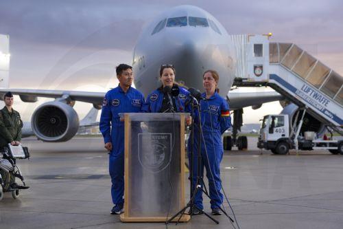 epa13293355 European Space Agency (ESA) astronaut Sophie Adenot (C) of France talks to the media upon arrival at the military section of Cologne Bonn Airport, Germany, 10 October 2026. After 237 days in space, French astronaut Sophie Adenot of the European Space Agency (ESA) returned safely to Earth aboard a SpaceX Dragon capsule, which splashed down in the...