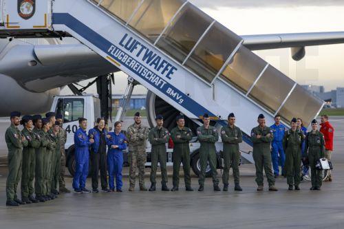 epa13293361 European Space Agency (ESA) astronaut Sophie Adenot (C) of France poses for a group photo after disembarking from a plane upon arrival at the military section of Cologne Bonn Airport, Germany, 10 October 2026. After 237 days in space, French astronaut Sophie Adenot of the European Space Agency (ESA) returned safely to Earth aboard a SpaceX...