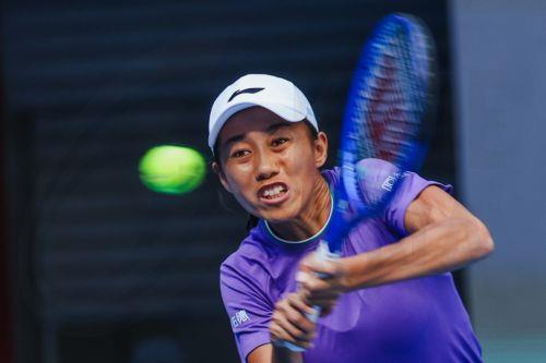 epa13293441 Zhang Shuai of China in action against Erin Routliffe of New Zealand and Aldila Sutjiadi of Indonesia during her Women’s Doubles match at the China Open tennis tournament in Beijing, China, 10 October 2026. China Open runs from 28 September through 11 October.  EPA/WU HAO