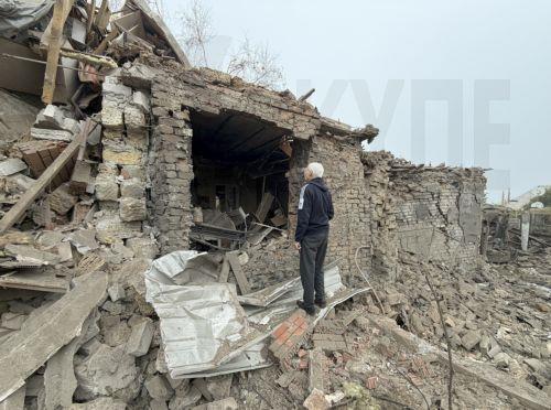 epa13293548 A man inspects the site of a Russian attack on a private building in Zaporizhzhia, Ukraine, 10 October 2026, amid the ongoing Russian invasion. At least five people, including two children, were killed and 11 others injured in overnight Russian strikes on the residential area, according to the State Emergency Service.  EPA/DARYNA NAUMOVA
